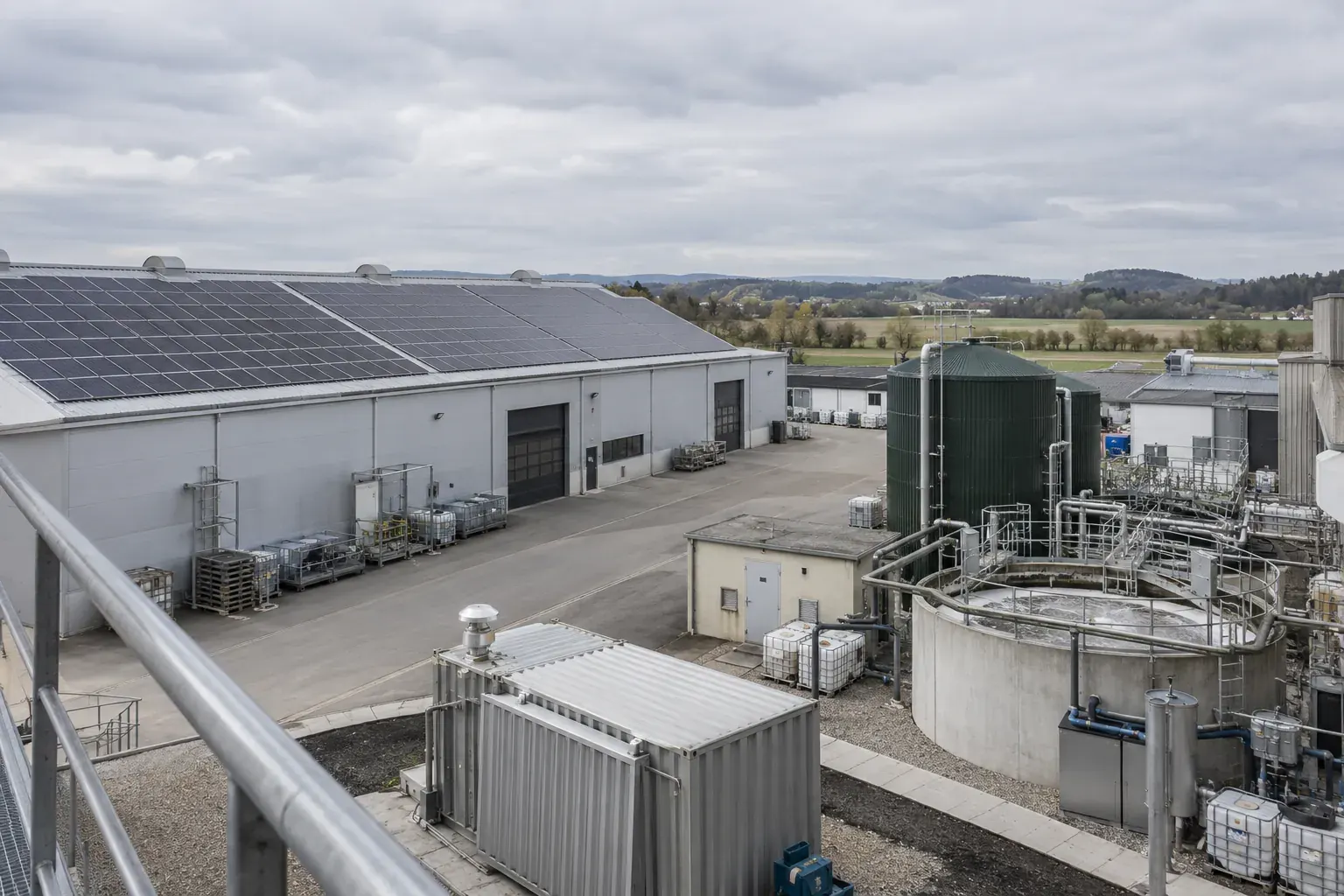 Industrial site with rooftop solar panels and water-treatment equipment
