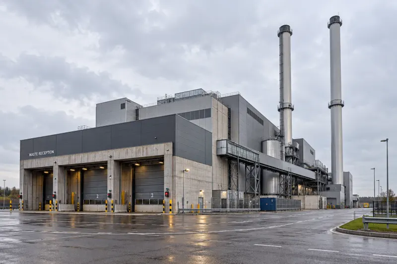 Waste reception bays and flue stacks at a waste-to-energy plant